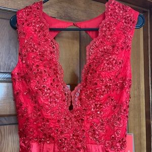 NEVER WORN red dress with backless back and beautiful jewels.